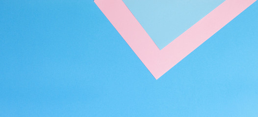 Color papers geometry flat composition background with pink and blue tones