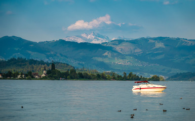 View of the Upper Zrucih Lake (Obersee), with the Santis peak and the village of Busskirch in the background, Sankt Gallen, Switzerland