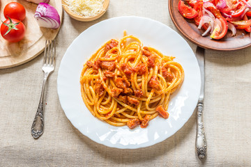 Traditional Italian lunch - Pasta Ammatricana and salad