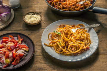 Traditional Italian Pasta Amatriciana on a rustic dark background