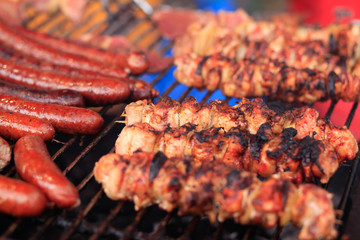 fried sausage and shashlik on the grill.