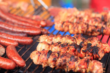 fried sausage and shashlik on the grill.