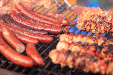fried sausage and shashlik on the grill.