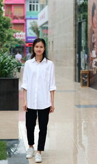 a woman walking in downtown in Vietnam