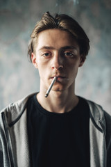 Young man smoke cigarette, addiction concept