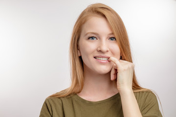 beautifyl young woman is biting her nails. bad habbit concept. gnaw fingernailes. nail biting.