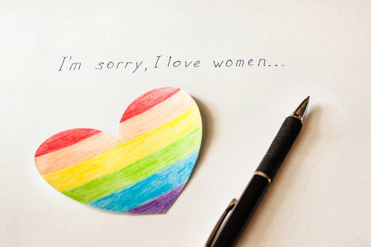 Inscription on white background I'm sorry I love women, heart in the form of a flag LGBT and a pen, lesbian