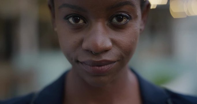 close up portrait beautiful african american woman looking up confident independent black female wearing nose ring feminine beauty slow motion