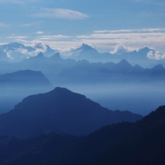 Fototapeta na wymiar Mountain ranges in Switzerland at sunrise. Distant view of Mount Santis.