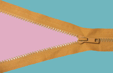 Orange zipper on pink and blue background © sritakoset