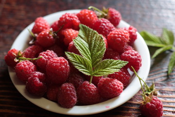 Ripe raspberries in a bowl.