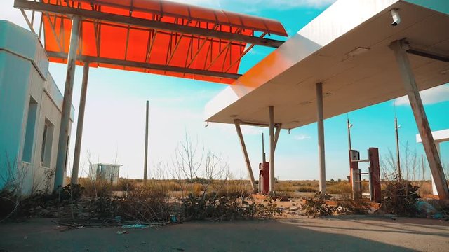 main street of america. Route 66. crisis road 66 fueling slow motion video. Old dirty deserted gas station. U.S. closed supermarket store shop Abandoned gas station lifestyle oil end of fuel the world