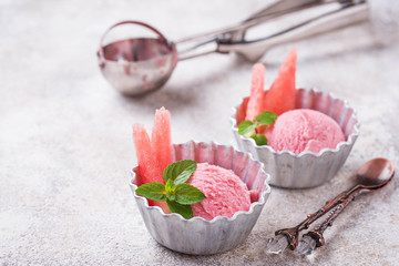Watermelon ice cream in metal bowls 