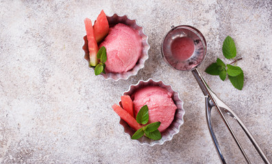 Watermelon ice cream in metal bowls 