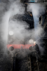 Steam train getting cleaned
