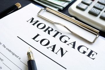 Mortgage loan form, money and calculator.