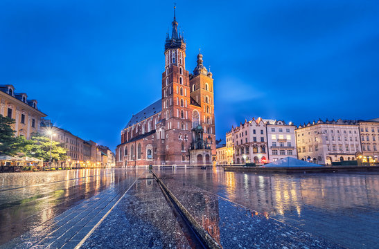 Basilica of Saint Mary at dusk with reflection in Krakow, Poland