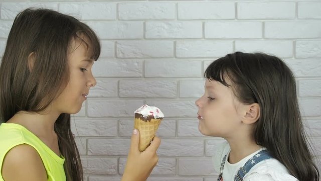 Children with ice cream. Little girls eat ice cream.
