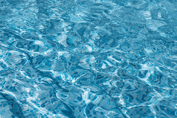 Blue swimming pool rippled water background