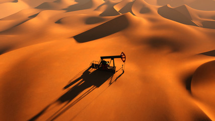 Oil pump between sand dunes top view 