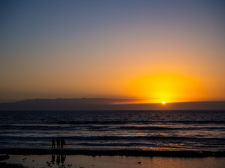A simple and basic sunset over the sea and waves