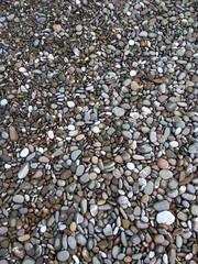 Abstract background with stones on the sea shore. Pebble heap. Nature and abstract backdrops and wallpapers.