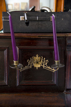 Old metal candle holder with candles