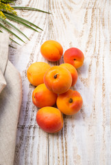 Apricots on wooden background