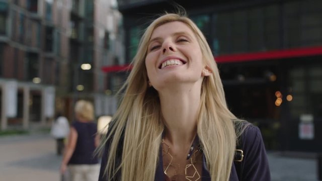 portrait of young beautiful blonde woman smiling happy enjoying urban lifestyle