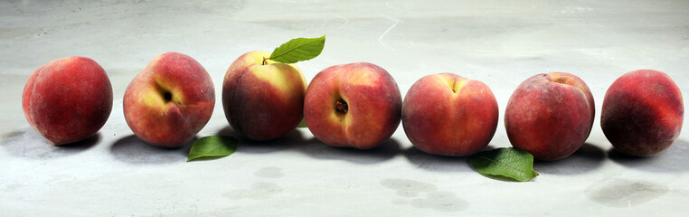 A group of ripe peaches on table