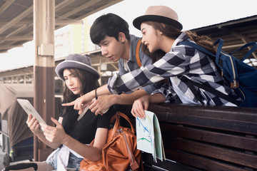 Traveler are discussing about the way after go out of the train station