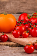 Pile of washed tomatoes on the table. Close up. Clean red and yellow tomatoes.