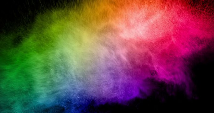 abstract real multicolor powder explosion on black background, slow motion movement