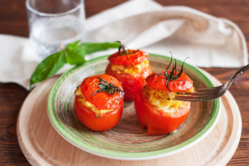Baked tomatoes stuffed with scrambled eggs - obrazy, fototapety, plakaty