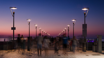 Naklejka premium PIER - A holiday sunset on the sea coast in Kolobrzeg