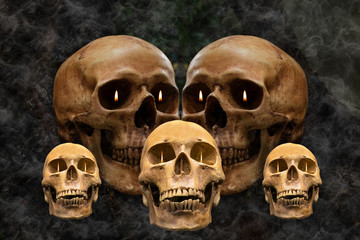 The skulls has a flaming eye in the smoke.Still life style and art visual with selective focus.