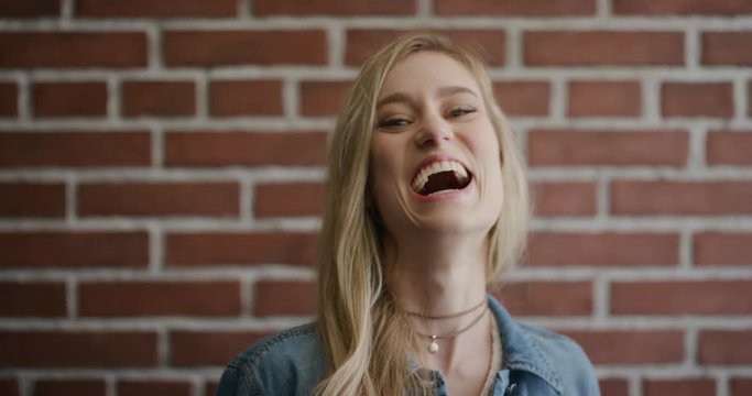 portrait beautiful young blonde woman student laughing enjoying success attractive caucasian female looking cheerful slow motion