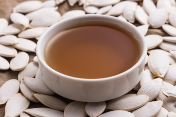 pumpkin seed oil on a rustic background