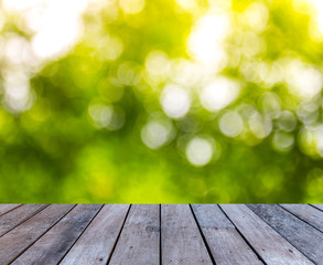 wood plank with abstract natural green blurred bokeh background for product display