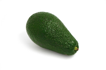Delicious fresh ripe green avocado isolated on a white background, natural shadow.