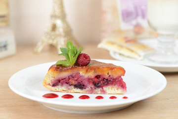 cake with raspberries on a white plate
