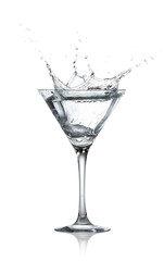 glass with splash of transparent alcohol drink