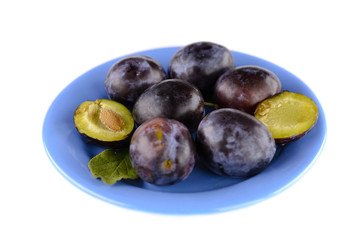 A plate of delicious ripe plum with white background.