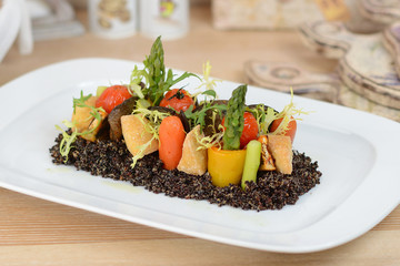 Baked vegetables: potato, zucchini, eggplant on plate. Vegetarian food