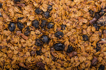 Granola baked in oven with nuts