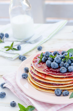 Vintage pancakes outside garden with blueberries