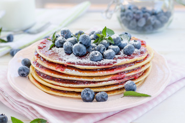 Vintage pancakes outside garden with blueberries