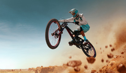 Cyclist riding a bicycle. Downhill.