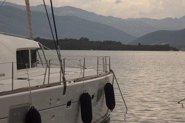 catamaran at sea and mountains in the background