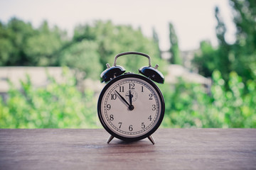 Talarm clock on the windowsill